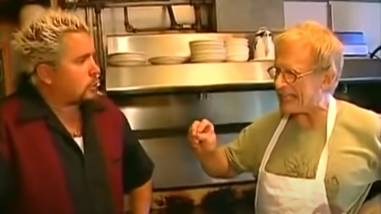 Guy talking to chef
