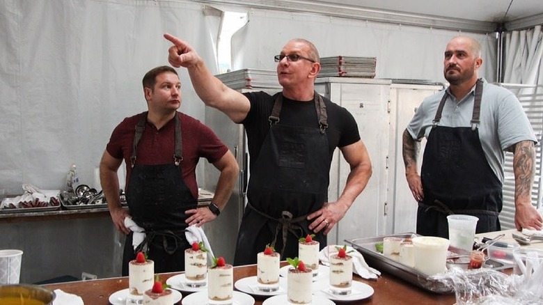 Robert Irvine standing in kitchen 