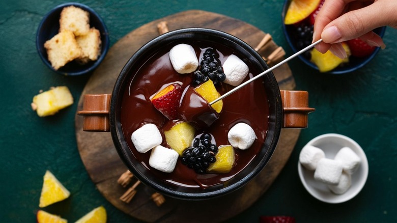 Chocolate fondue with fruit, marshmallows