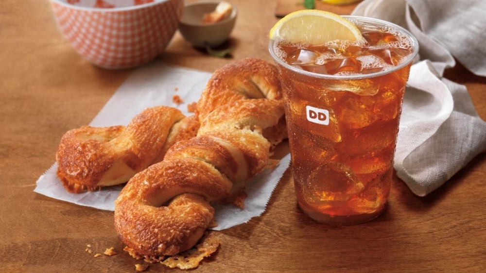 White Cheddar Bagel Twists next to drink on table