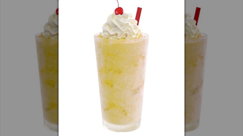 Pineapple milkshake on white background