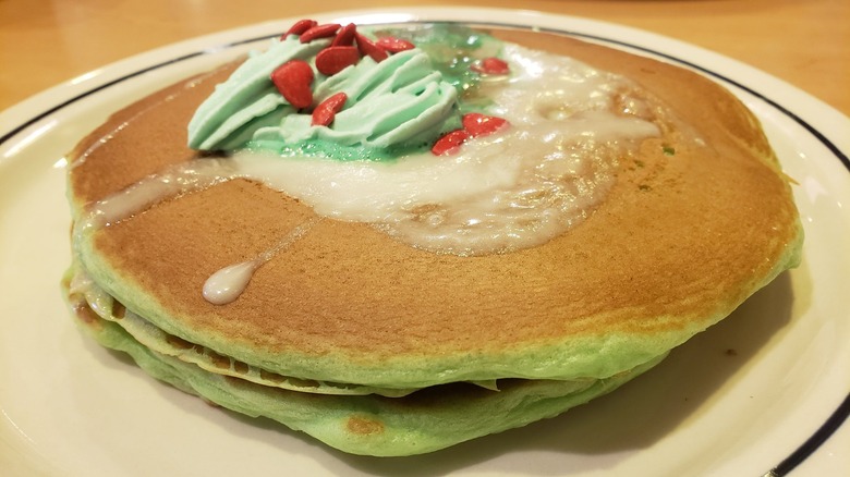 Green pancakes with icing sprinkles