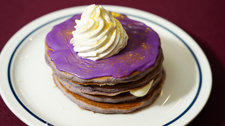 Pancakes purple icing whipped cream