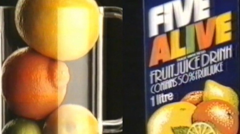 Five Alive juice carton with stack of oranges