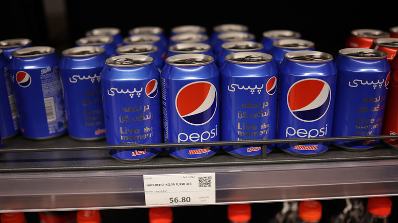 Cans of Pepsi on shelf