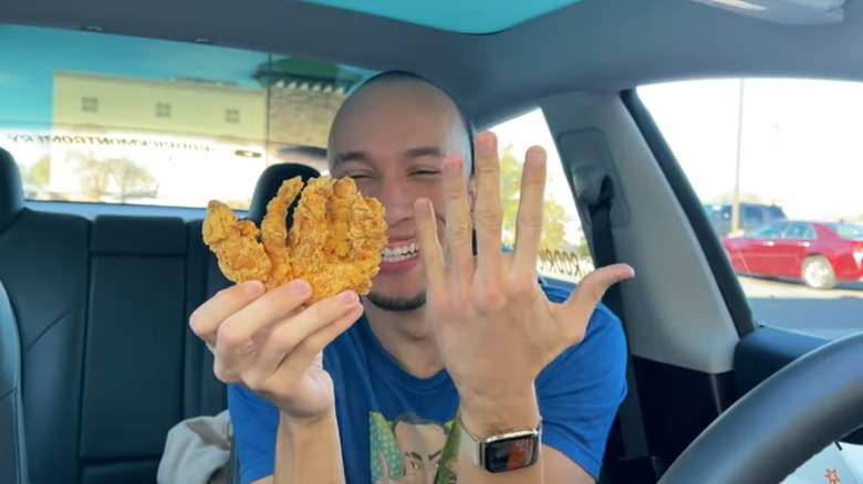 man holds Rip'n Chick'n