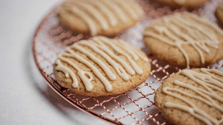 Iced maple cookies on rack