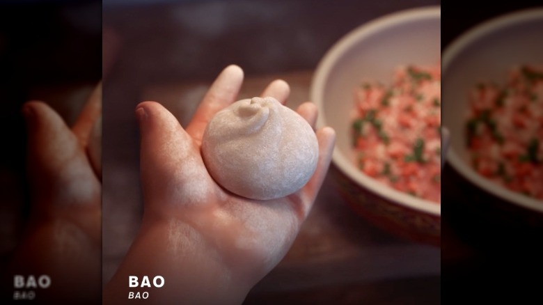 mother holding a bao