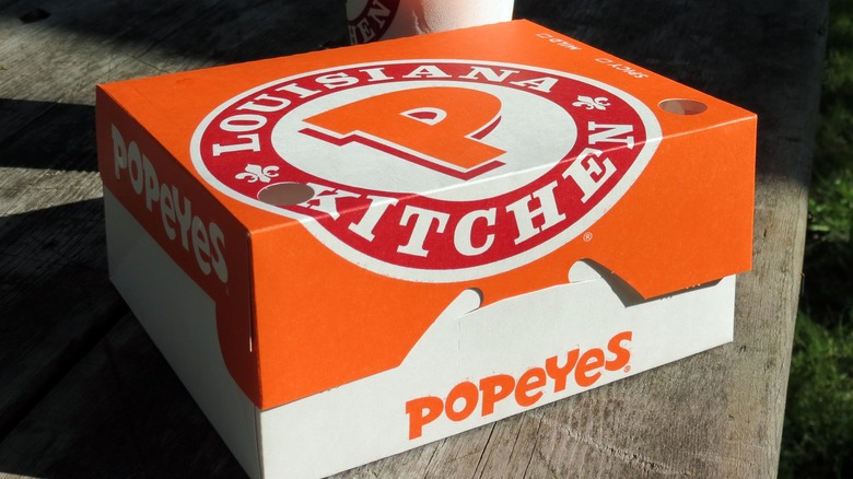 Popeye's container on picnic table