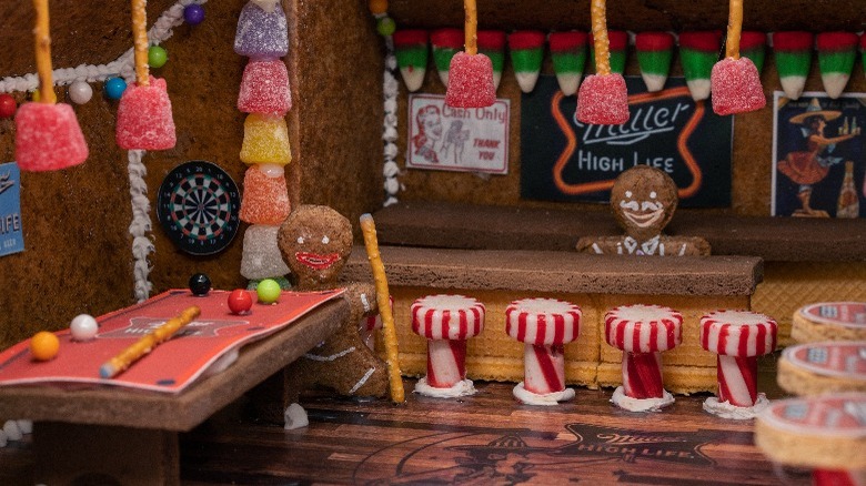 Masked gingerbread man, and a house and year (2021) made of gingerbread