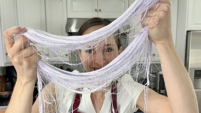 woman holding dragon beard' candy