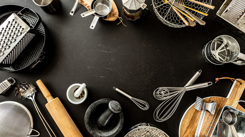 Cooking tools on black background