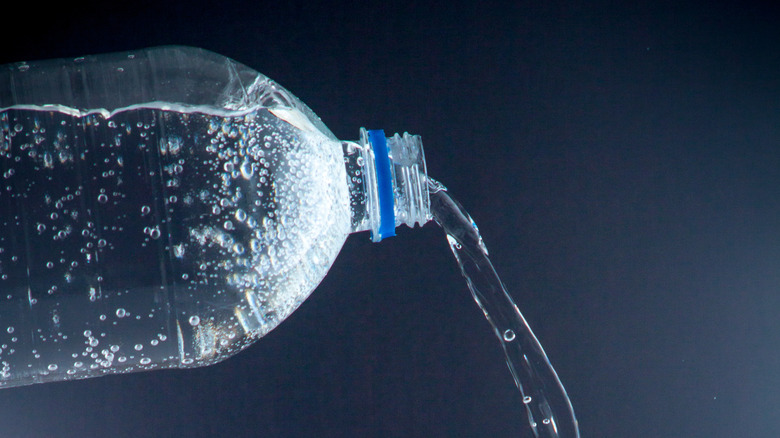 carbonated water pouring from bottle