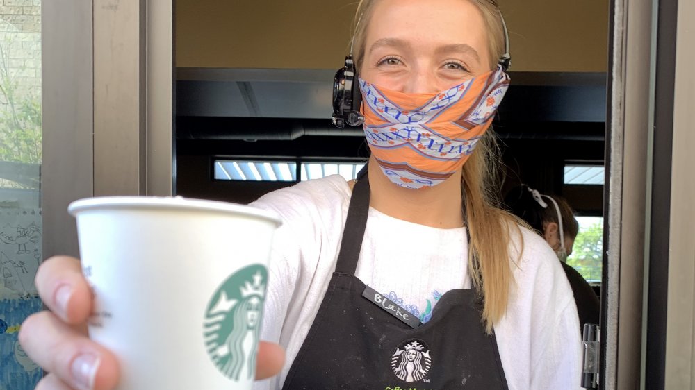 starbucks barista drive-thru with face mask