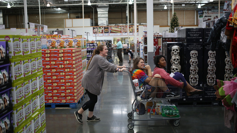 costco shoppers browse halloween decor