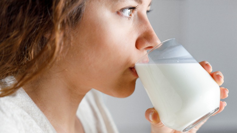 Woman drinking glass of milk