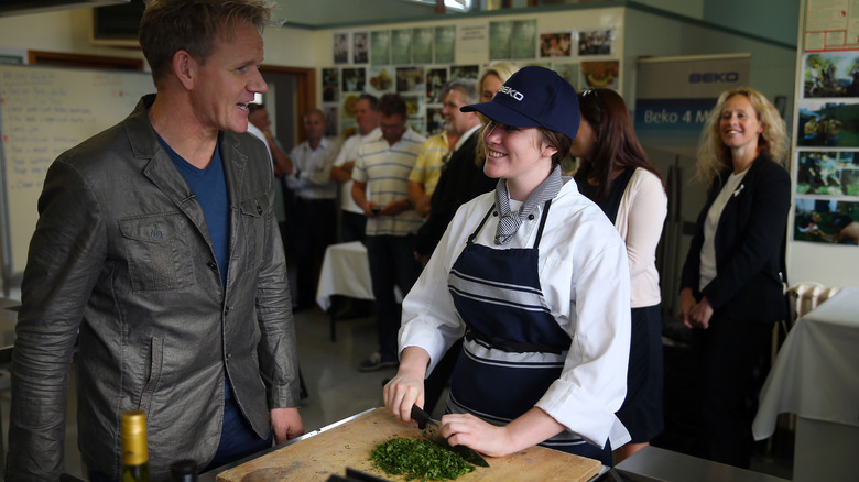 Gordon Ramsay talking to student chef