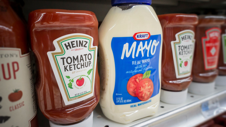 Bottles of Heinz products on supermarket shelf