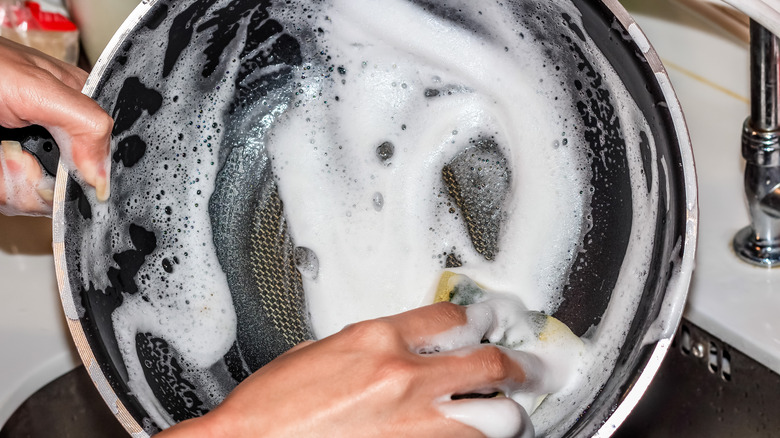 Scrubbing a dirty pan