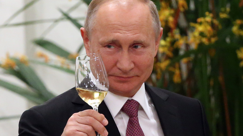 Vladimir Putin holding wine 