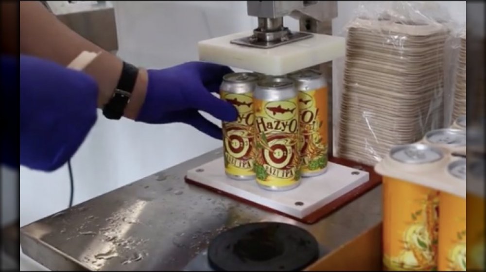 Cans of Hazy-O! oat milk beer at Dogfish Head Brewery