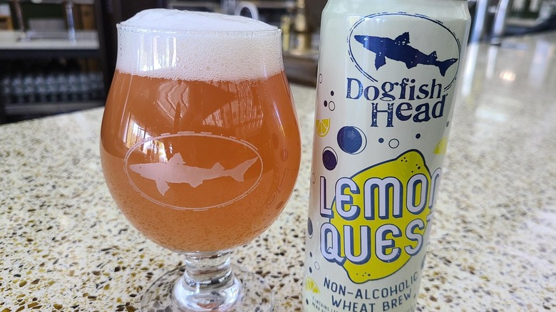 A glass and can of Lemon Quest NA beer