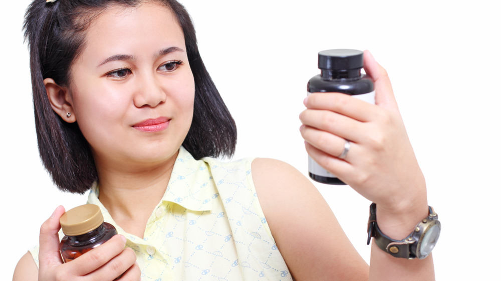 Woman Taking Supplement