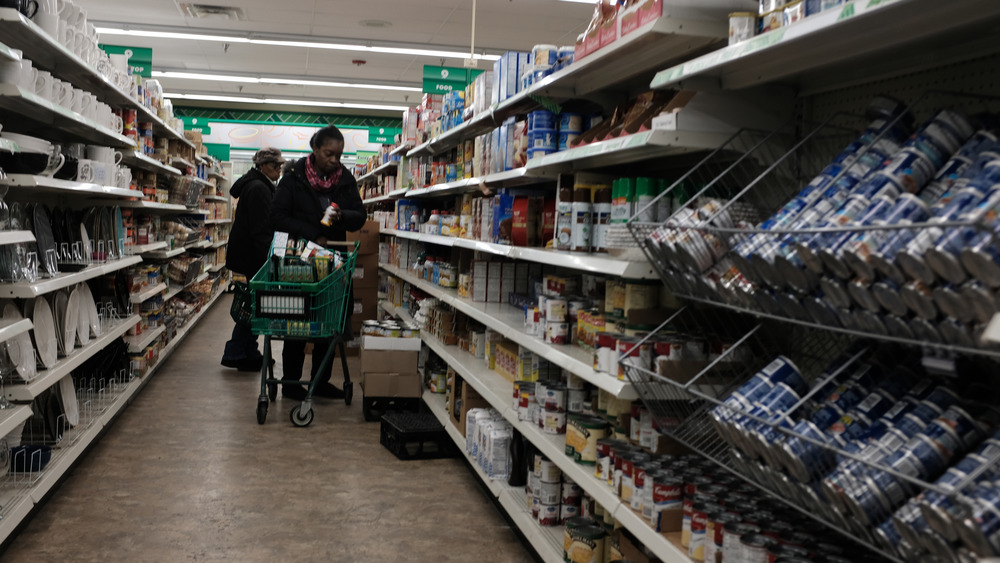 people shopping at dollar store