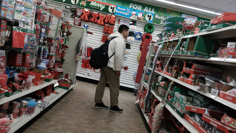 man browsing at dollar store