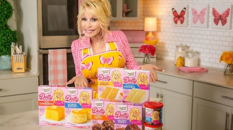 Dolly Parton poses with baking mixes