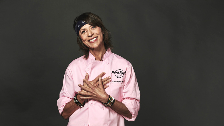 Dominique Crenn smiling in pink jacket