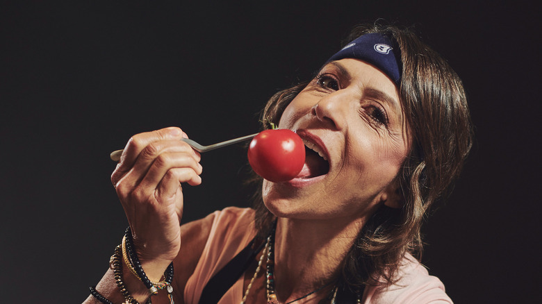 Dominique Crenn eating tomato