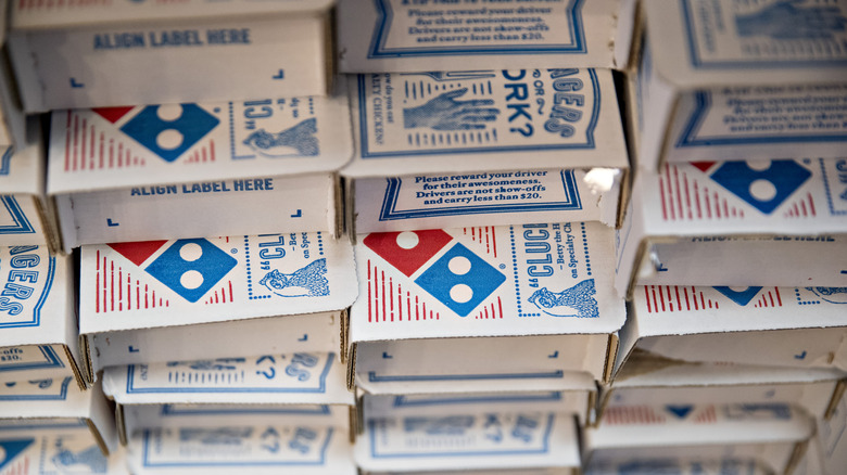 stacks of Domino's pizza boxes