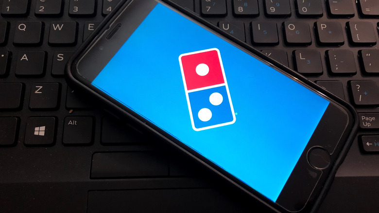 Cell phone with Domino's logo on keyboard 