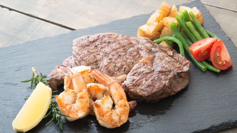 surf and turf meal with shrimp and steak