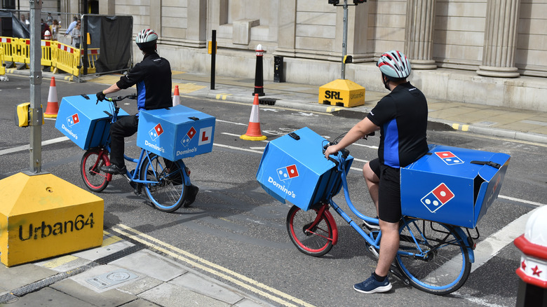 Domino's delivery people on bikes