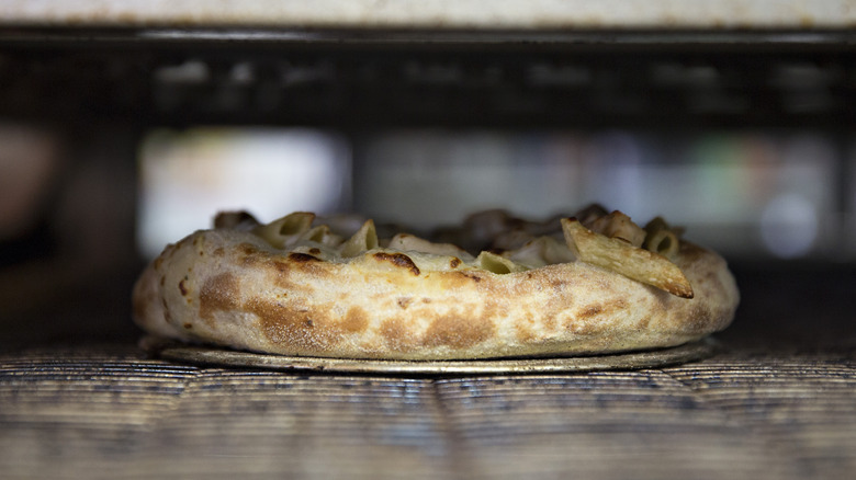 Domino's Chicken Alfredo pasta in oven