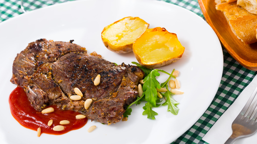 Well-done steak with ketchup