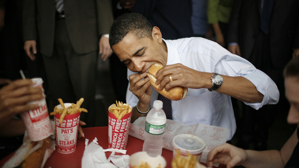 Barack Obama eating cheesesteak