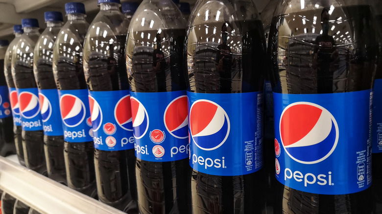 Bottles of Pepsi on a shelf