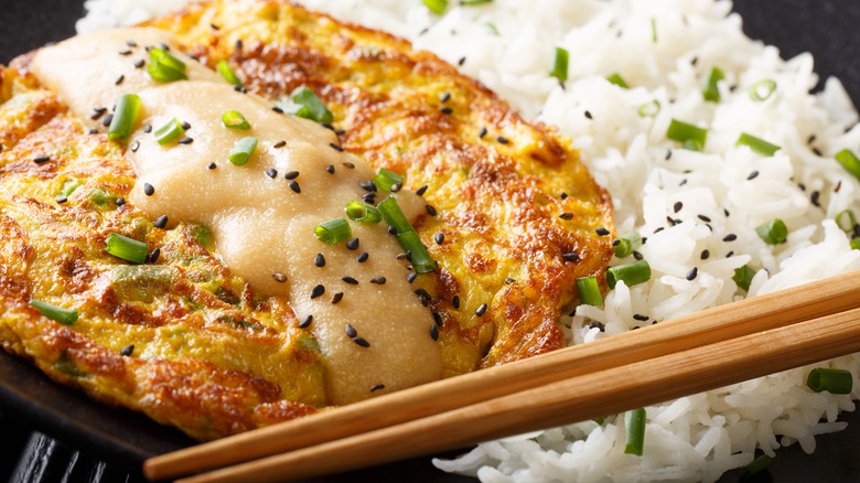 Egg foo young served with white rice and gravy