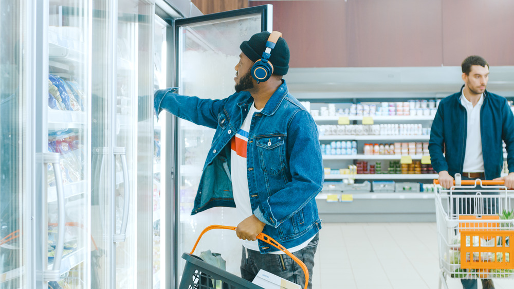 Man grabbing a frozen entrée