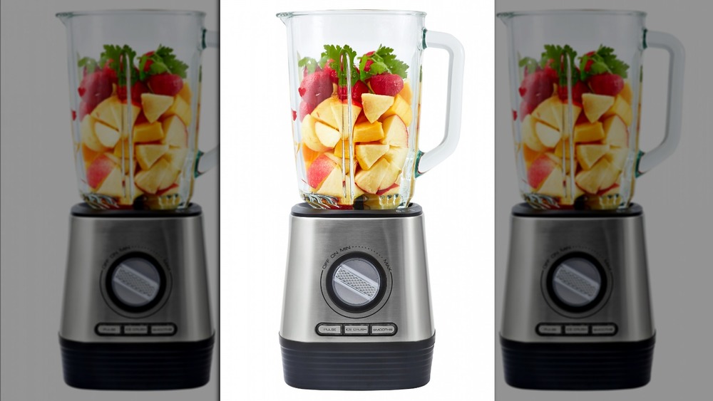 Blender with assorted fruits