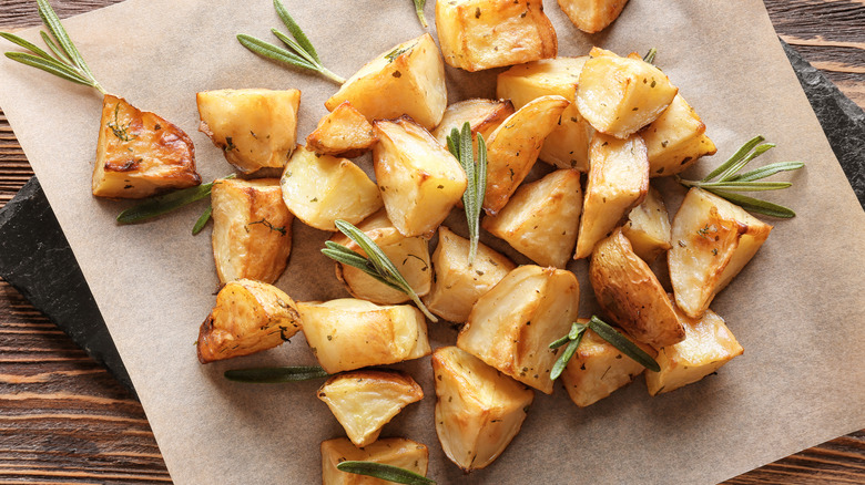 Roasted potatoes with rosemary on parchment