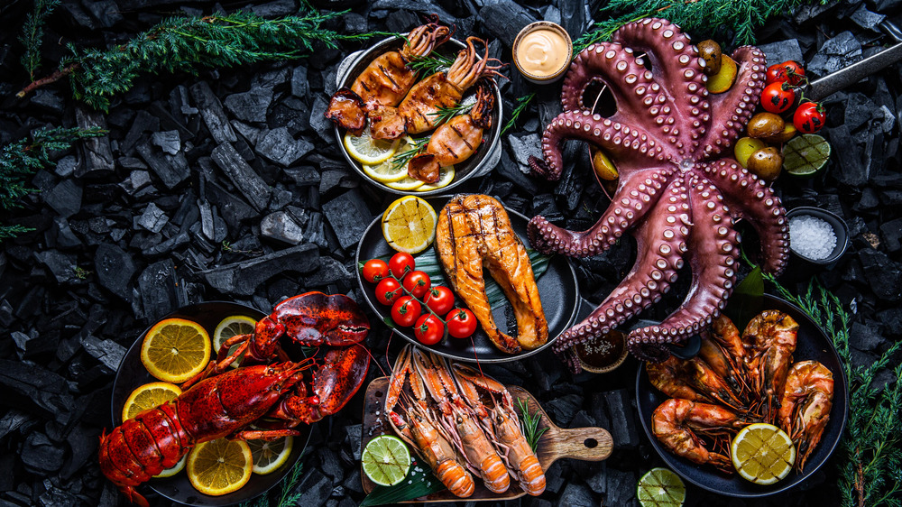 variety of seafood on a black background