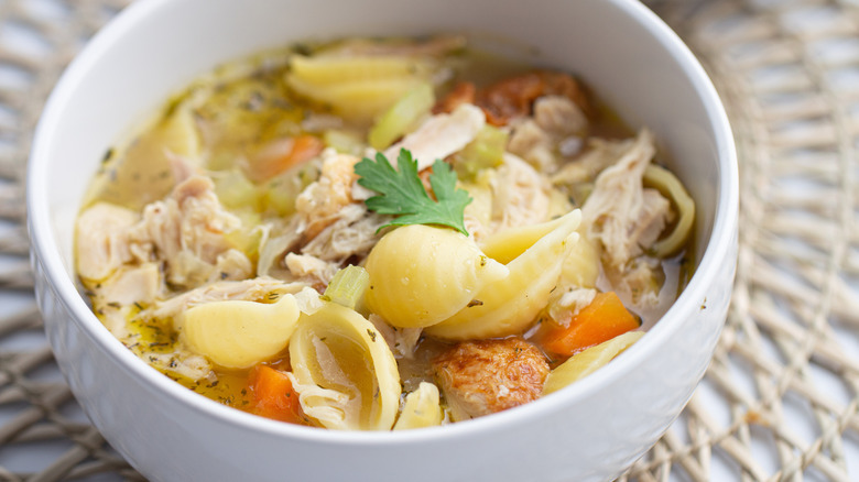 chicken soup in white bowl