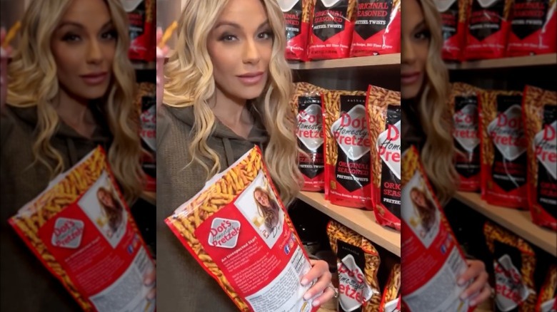 Dorit Kemsley holding Dot's Pretzels