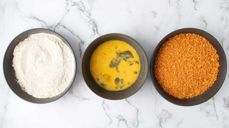 flour eggs crumbs in bowls