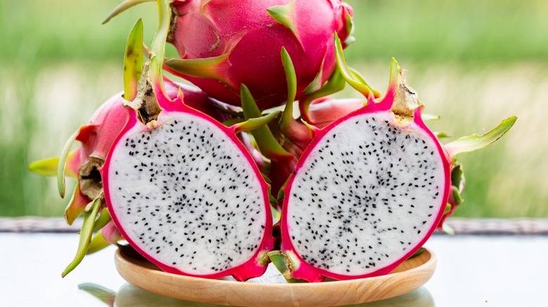 halved dragon fruit on a plate