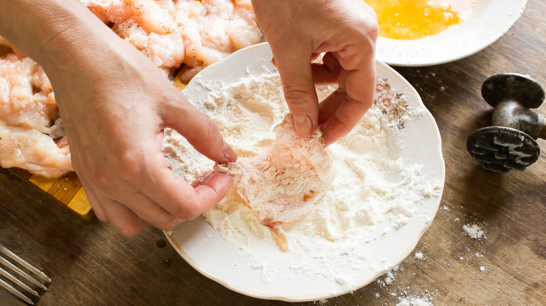 dredging chicken in flour